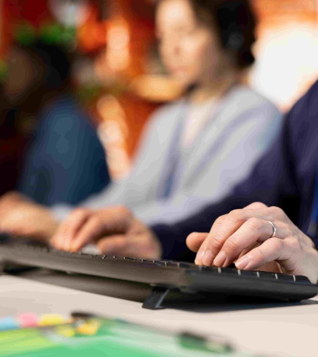 call-center-agent-typing-pc-keyboard-assisting-customers-through-live-chat (1)
